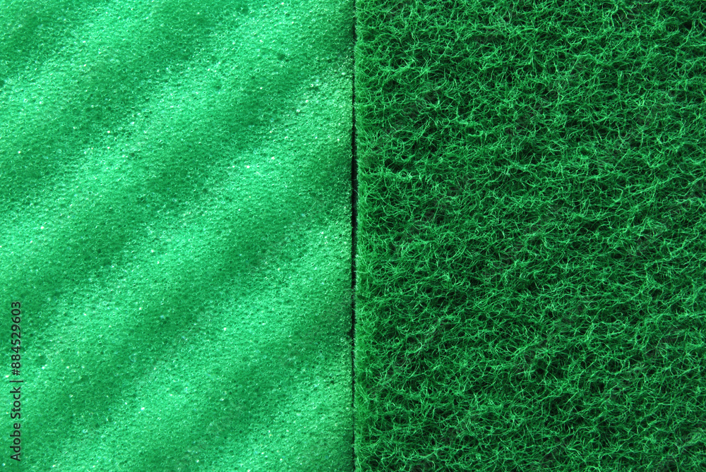 Fototapeta premium Both sides of a green porous cleaning sponge texture as background 