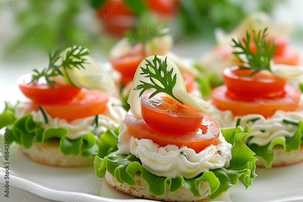 Sophisticated tomato and cream cheese canapés elegantly presented on a white plate highlighting a refined appetizer selection Sophisticated tomato and cream cheese canapés elegantly presented on a white plate highlighting a refined appetizer selection
