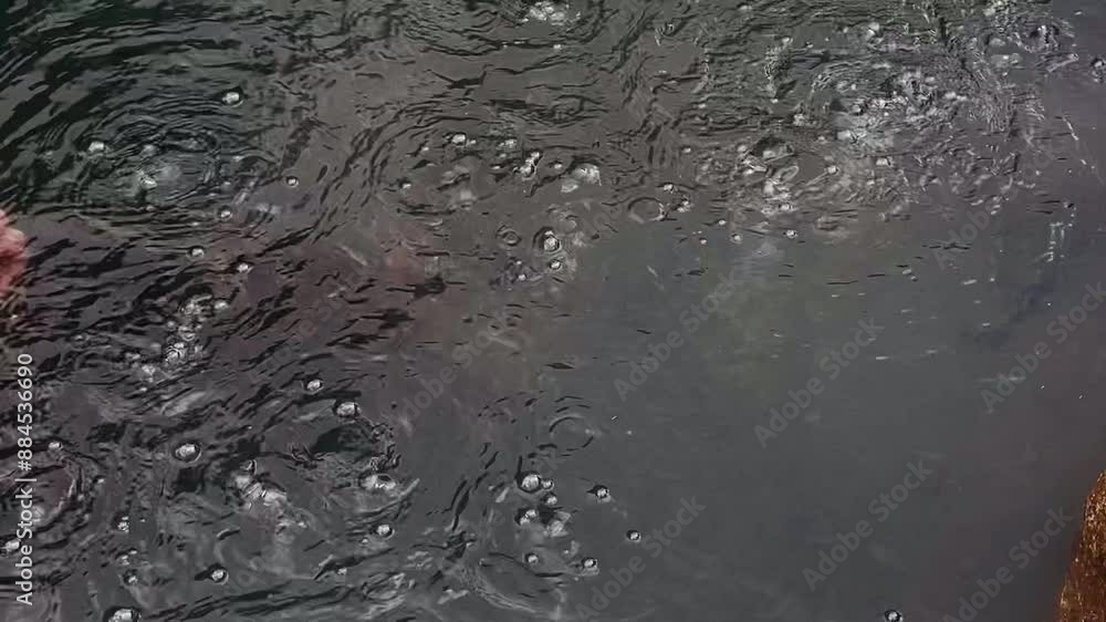Natural hot spring bath under this water has active volcano Natural hot spring bath under this water has active volcano