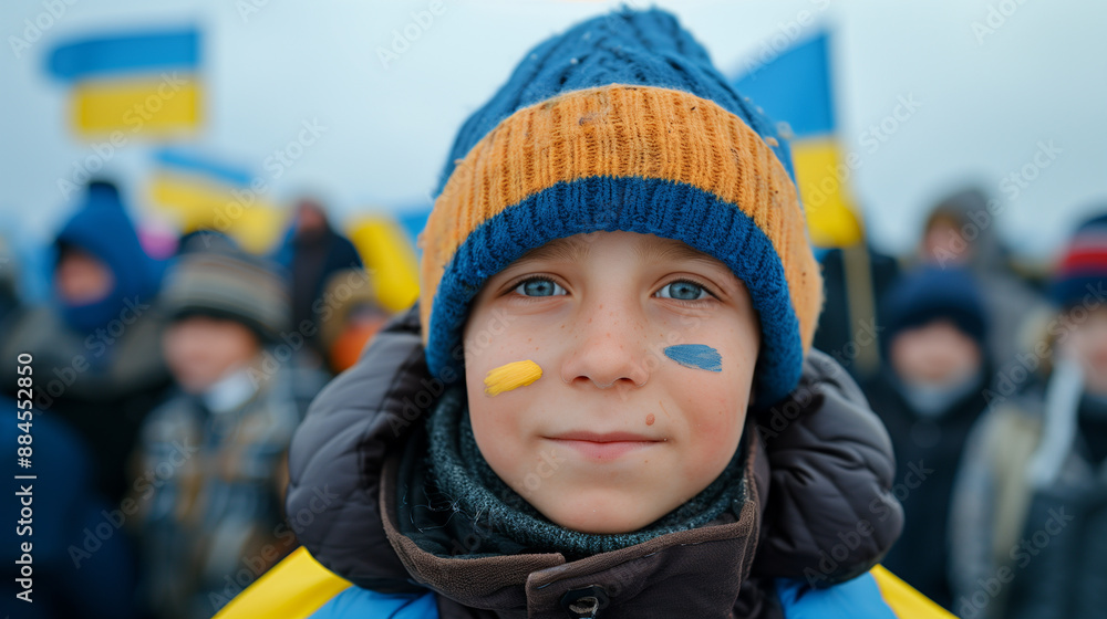 Ukraine Independence Day boy with Ukrainian flag on her face standing in the crowd Ukraine Independence Day boy with Ukrainian flag on her face standing in the crowd