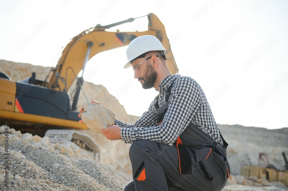Male worker with bulldozer in sand quarry Male worker with bulldozer in sand quarry