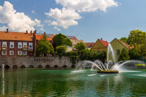 A town of Tapolca in Balaton region of Hungary with lake in the middle of the city and fountain, carps in the lake photo