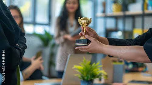 A manager handing out awards for top performers, proud and respectful, left third copy space