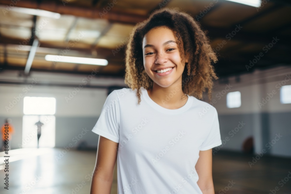 Portrait of a young African American woman in indoor basketball gym Portrait of a young African American woman in indoor basketball gym