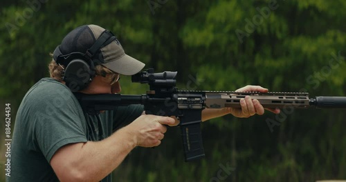Young man shooting an AR-15