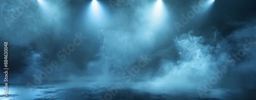 Empty dark stage with spotlights, fog and smoke in a theatre. Mysterious room with concrete floor. Festival, event, concert, dramatic atmosphere concept.