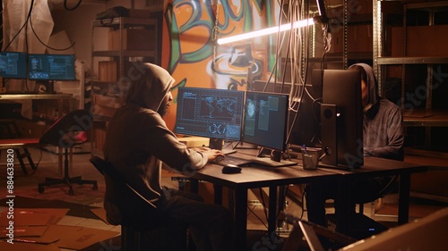 Fotografi Hackers rushing to exit secret base after hearing police sirens, being wanted un