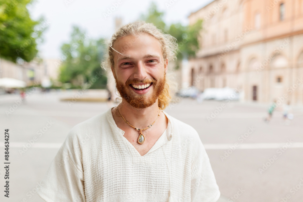 Smiling portrait of young caucasian man looking at camera standing at city street. Joyful millennial male feeling positive, closeup outdoor head shot. Happy people Smiling portrait of young caucasian man looking at camera standing at city street. Joyful millennial male feeling positive, closeup outdoor head shot. Happy people