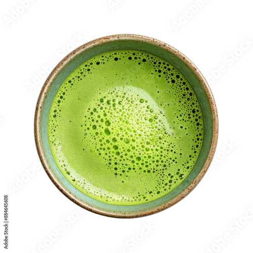 Top view of a cup of freshly brewed green tea with frothy surface. photo