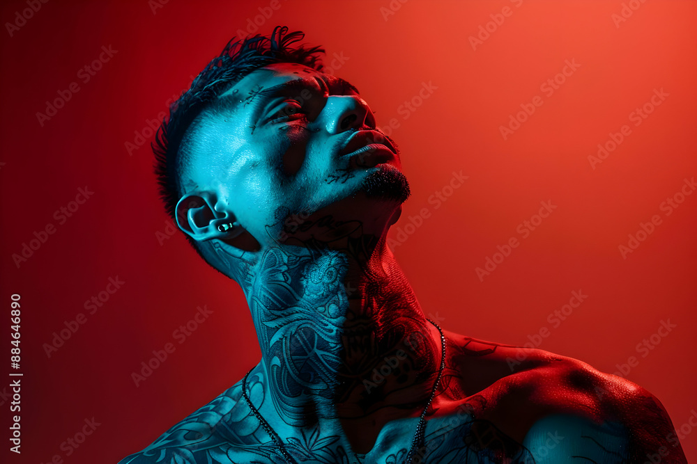 Tattooed Man in Red and Blue Light Tattooed Man in Red and Blue Light