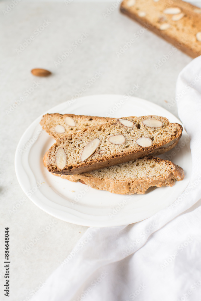 almond biscotti on a white plate, almond cantucci cookies on a white plate, biscotti cookies or twice baked cookies almond biscotti on a white plate, almond cantucci cookies on a white plate, biscotti cookies or twice baked cookies