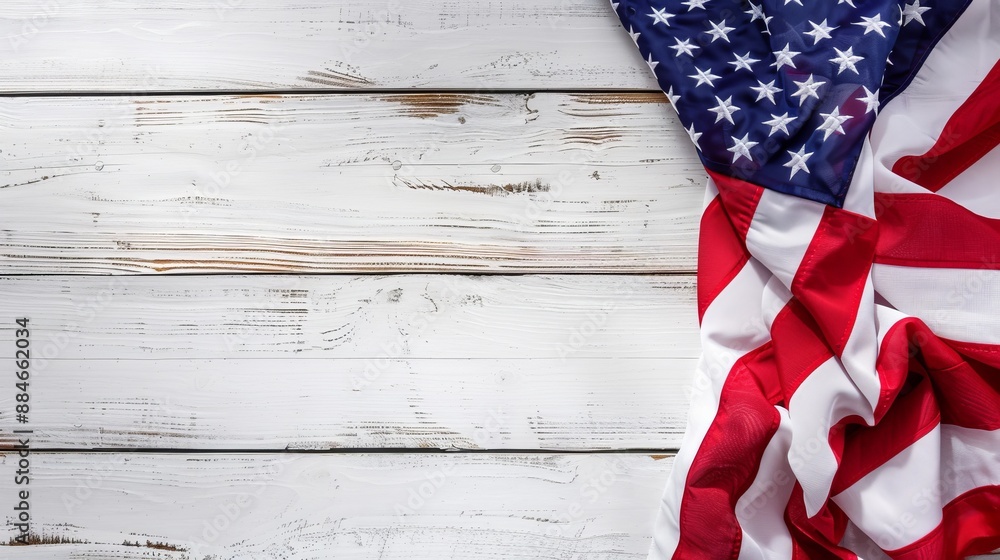 Obraz premium An image showing an American flag on a white wooden plank background styled in a flat lay arrangement, symbolizing patriotism, heritage, and rustic charm within a contemporary style.
