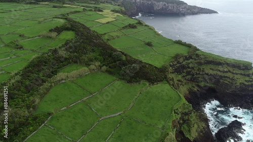 Aerial view of cattle pasture on the coastal cliffs of Ponta do Raminho district - Terceira Island, Azores archipelago, Portugal photo