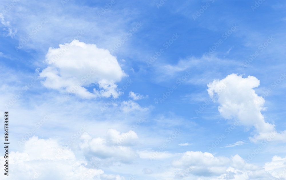 White fluffy cloud over blue sky, nature background, season and weather concept White fluffy cloud over blue sky, nature background, season and weather concept