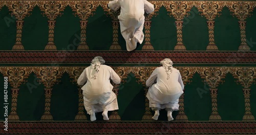 People, praying and prostration in mosque for religion, top view and worship in islam for gratitude. Men, above and community in salah for spiritual praise, faith and muslim in sujood for Allah