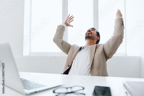 Man businessman gesturing laptop technology business office suit occupation job winner happy