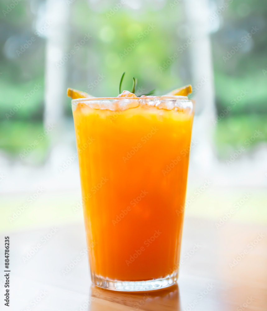 Fresh cold Orange juice with ice served in the summer in a restaurant to refresh yourself during a hot day Fresh cold Orange juice with ice served in the summer in a restaurant to refresh yourself during a hot day