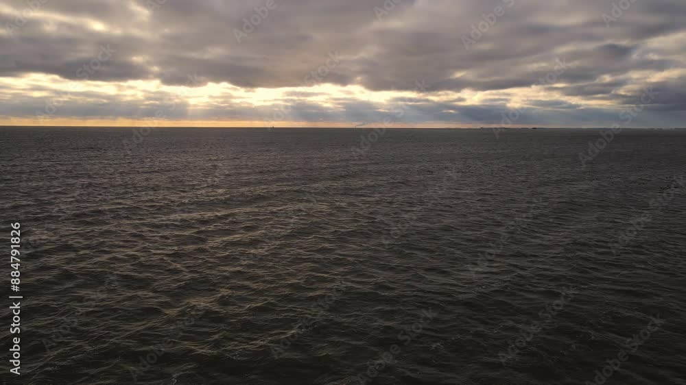 Sunset light and dramatic clouds over Lake Erie near Luna Pier Michigan, USA - one of the Great Lakes Sunset light and dramatic clouds over Lake Erie near Luna Pier Michigan, USA - one of the Great Lakes