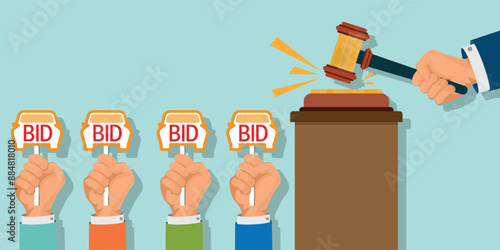 Hands holding auction paddle in shape of car and hammer.