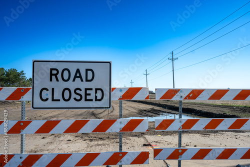 Road Closed Sign on Dirt Road photo