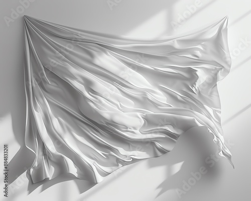 White fabric flowing gracefully in the wind against a clean white background.