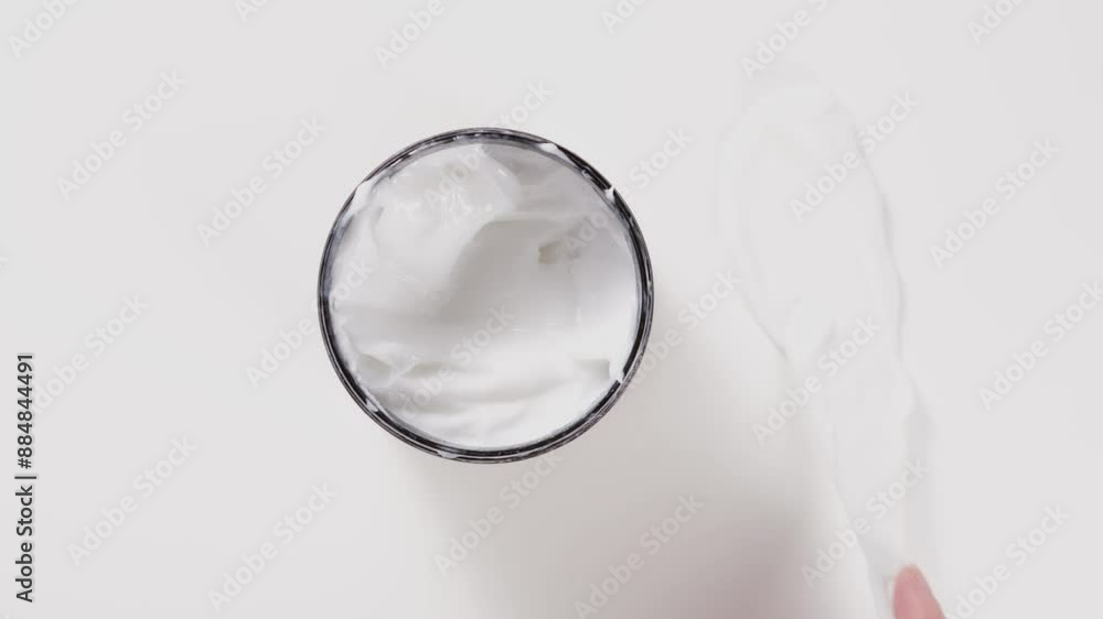 cream in jar make swatch with spatula top view. cream in jar make swatch with spatula top view.