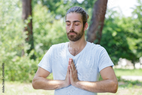 skinny sport man posing yoga hands photo