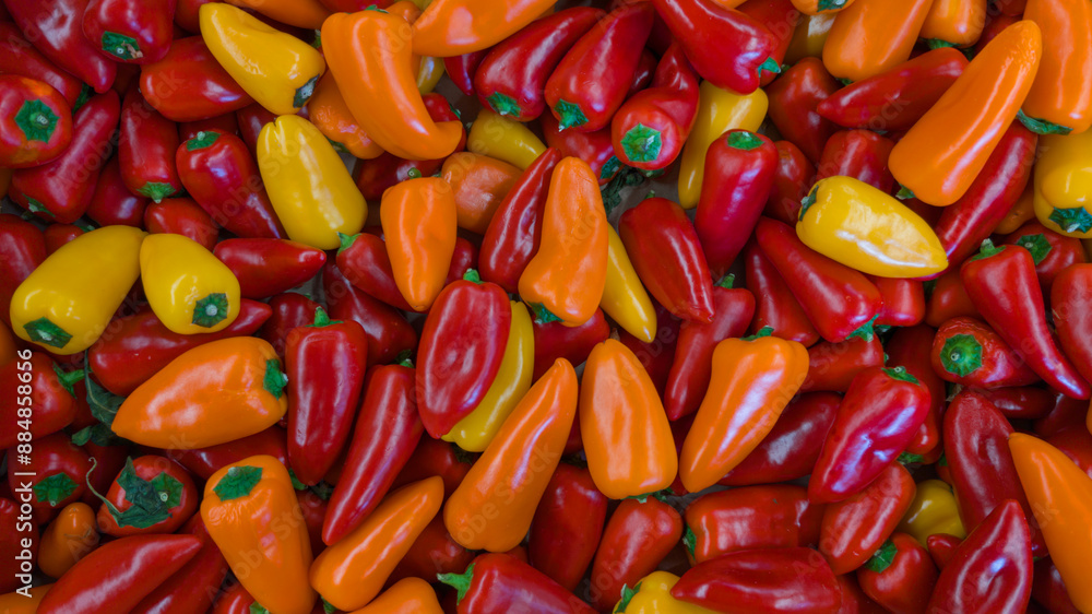 Red and yellow color small peppers background in top view Red and yellow color small peppers background in top view