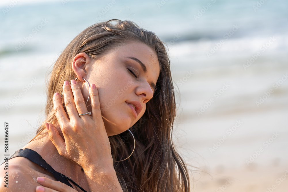 Portrait of smiling fashion woman relaxation on the tropical beach.Happy young beautiful girl enjoying and having fun on the tropical island.Summer vacation and travel Portrait of smiling fashion woman relaxation on the tropical beach.Happy young beautiful girl enjoying and having fun on the tropical island.Summer vacation and travel