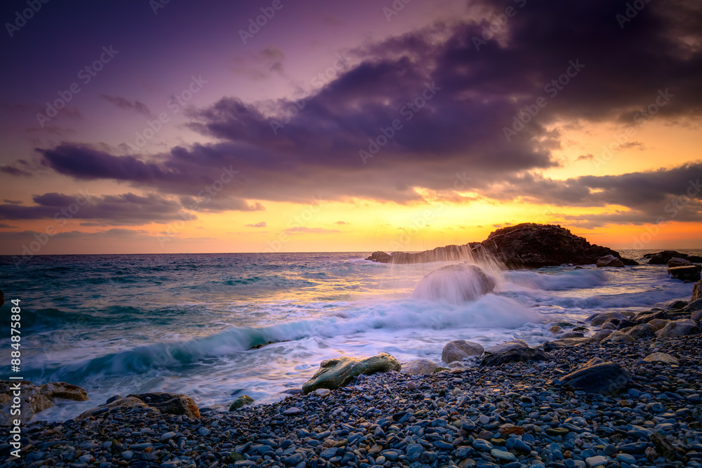 Obraz premium Sea Ocean. Sunrise time at the sea. Big roks. Wave hit the rock at beach, sea water splash up to the sky with sun. Sunset Sundown at Sea. Storm.