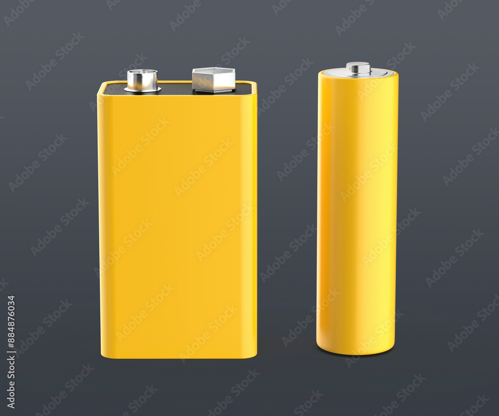 Yellow nine volt and AA size batteries on grey background Yellow nine volt and AA size batteries on grey background