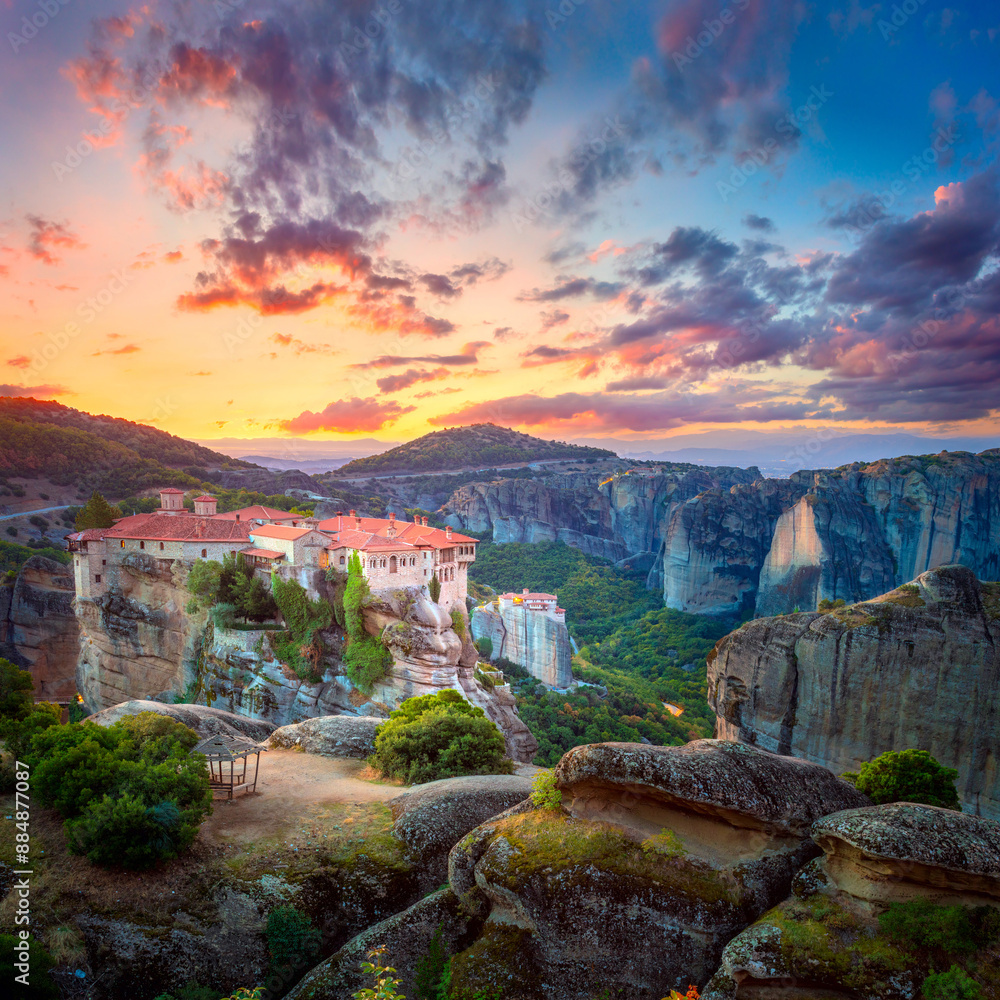 Great Meteora. Greece, Meteora Monasteries. Panoramic view of the Holy Monastery of Varlaam, located on the edge of a high cliff. Beautiful sunrise.