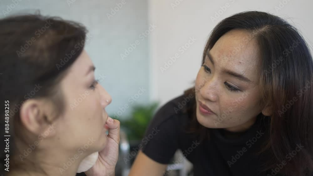 Young woman is make up her face at beauty salon. Young woman is make up her face at beauty salon.