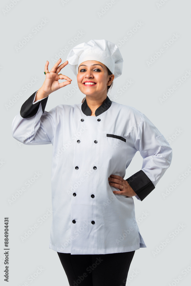Asian Indian Female Chef with Thumbs Up - Isolated on White Asian Indian Female Chef with Thumbs Up - Isolated on White