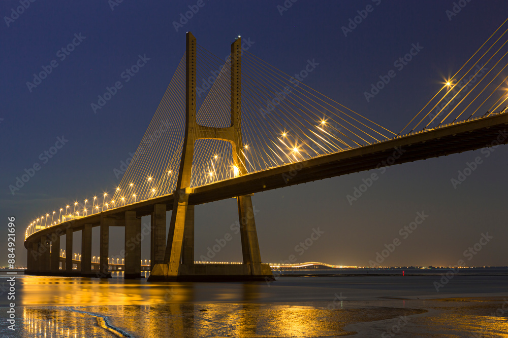 Fototapeta premium Famous Scenic Picturesque Vasco Da Gama Bridge in Lisbon in Portugal With Picture Made At Night