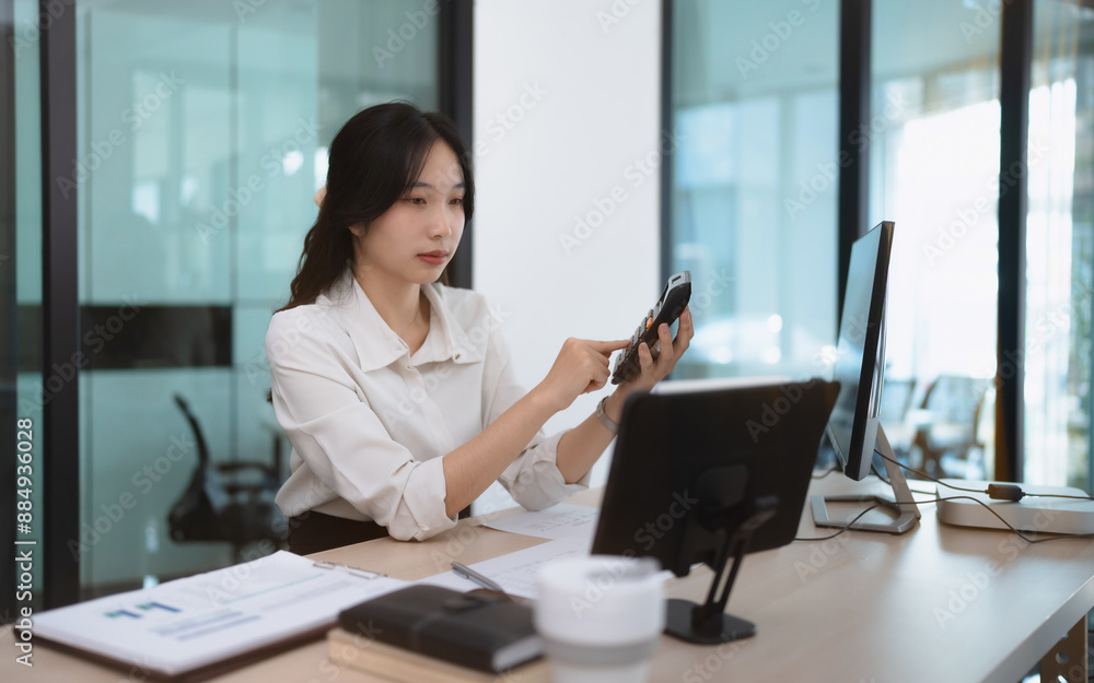 Business woman using mobile smartphone checking investment project Business woman using mobile smartphone checking investment project