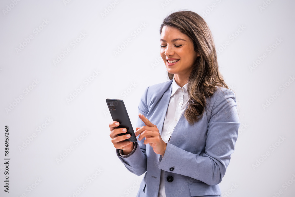 Portrait of cheerful businesswoman who is using smartphone. Portrait of cheerful businesswoman who is using smartphone.