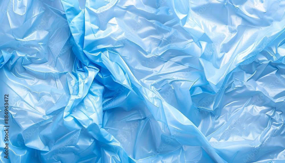 Fototapeta premium Crumpled light blue plastic bag as background, top view