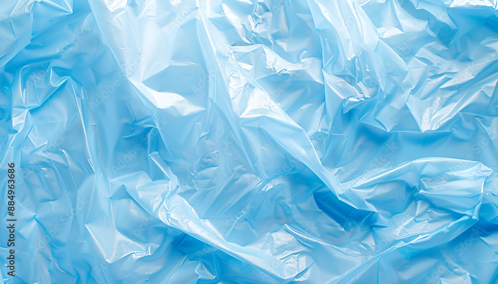 Obraz premium Crumpled light blue plastic bag as background, top view