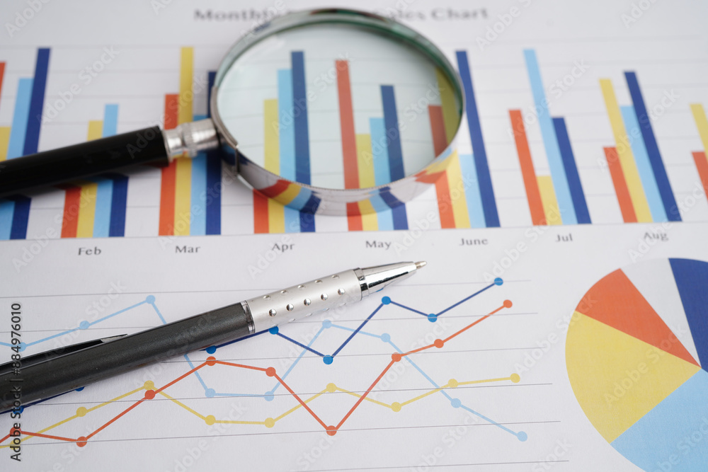 Magnifying glass on charts graphs paper. Financial development, Banking Account, Statistics, Investment Analytic research data economy. Magnifying glass on charts graphs paper. Financial development, Banking Account, Statistics, Investment Analytic research data economy.