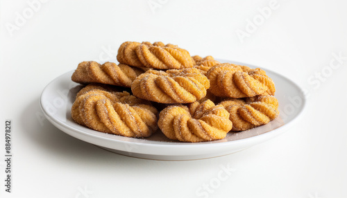 classic English jumbles, featuring twisted, spiced cookies with a light glaze, arranged neatly on a white porcelain plate against a clean white background