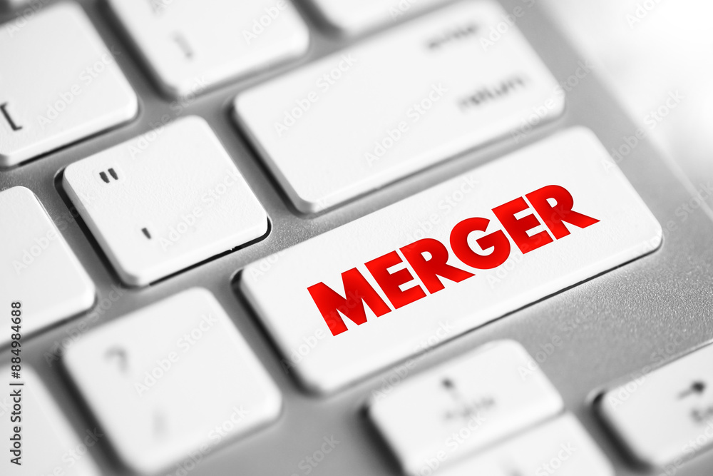 Merger - takes place when two companies combine to form a new company, text concept button on keyboard Merger - takes place when two companies combine to form a new company, text concept button on keyboard