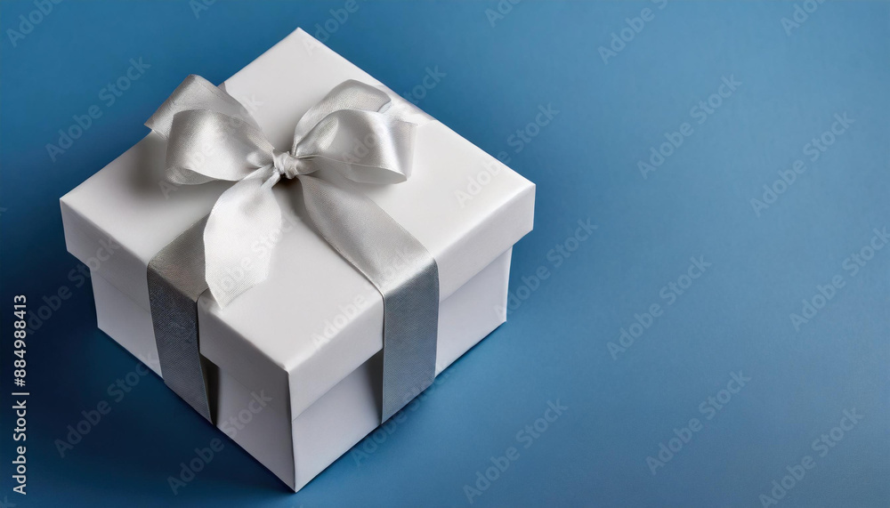 white box gift with elegant ribbon and light color background white box gift with elegant ribbon and light color background
