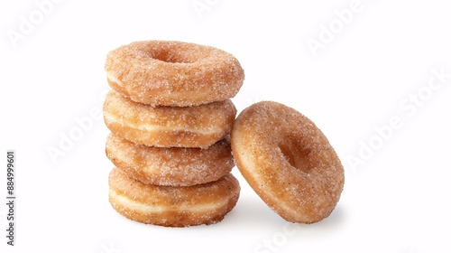A stack of cinnamon donuts with sugary glaze isolated on a white background.