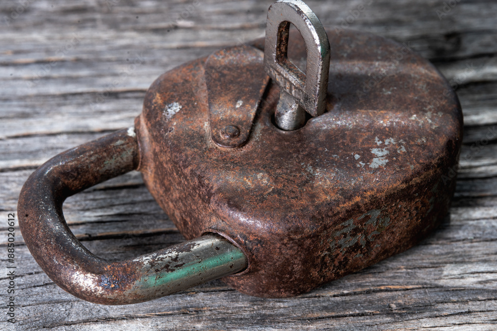 Conceptual image: Massive antique rusty key in the lock. Security and safety information, personal data concept. Horizontall image. Conceptual image: Massive antique rusty key in the lock. Security and safety information, personal data concept. Horizontall image.