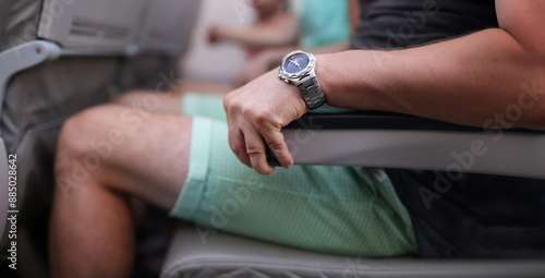 Obraz na plátne Close-up of scared man strongly grab armrest in plane