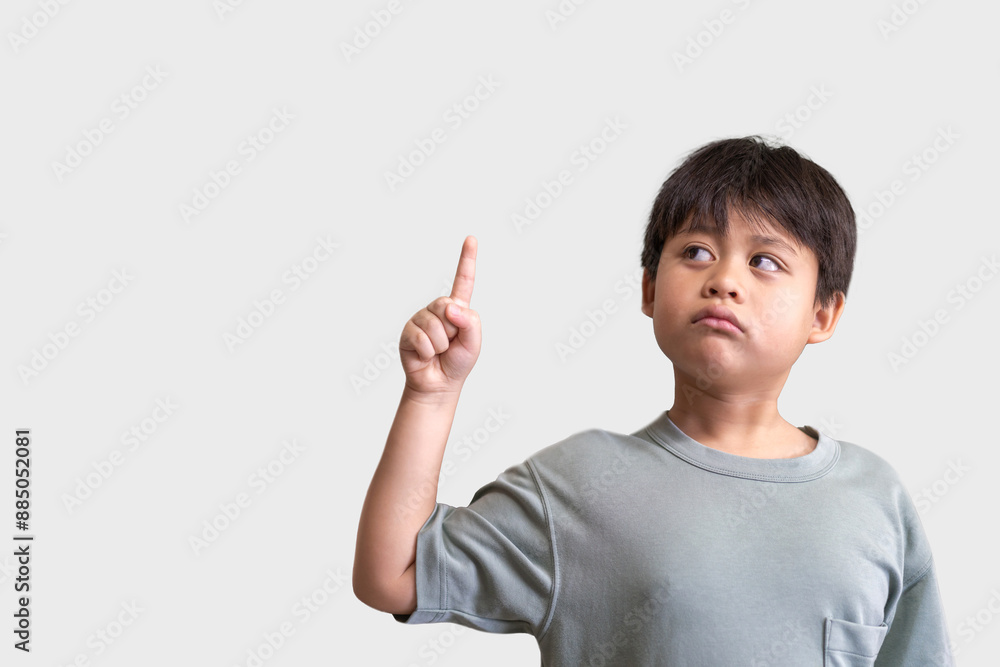 Young Asian boy raising finger, idea or asking a question, learning and the thought process of children, boy and his expressive gesture, education, curiosity, childhood and inspiration, intelligence Young Asian boy raising finger, idea or asking a question, learning and the thought process of children, boy and his expressive gesture, education, curiosity, childhood and inspiration, intelligence