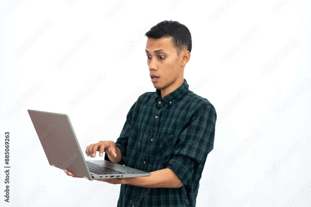 Asian man wearing a green checkered casual shirt is showing a laptop. business photo concept, student. Isolated white background. Asian man wearing a green checkered casual shirt is showing a laptop. business photo concept, student. Isolated white background.