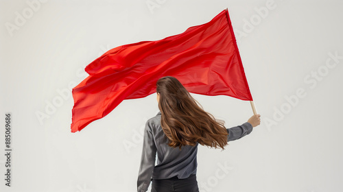 A woman holds a red flag in her hand against a white background.
