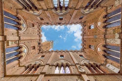 Siena - View from inside the Palazzo Pubblico at Piazza del Campo - old historic city in Italy photo